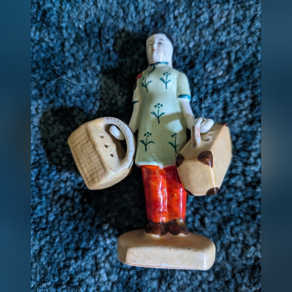 Vintage salt and pepper woman w luggage